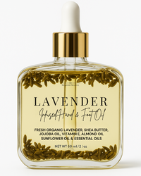 A clear bottle with a gold cap labeled 'LAVENDER Infused Hand & Foot Oil', containing visible yellowish liquid and floating ingredients such as shea butter and Jojoba oil.