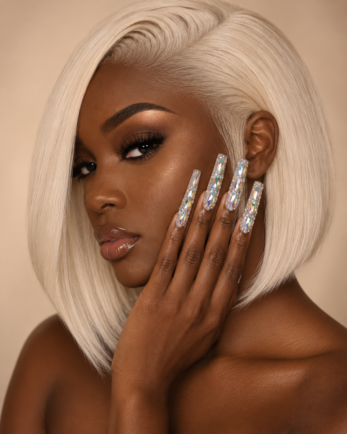 Woman with platinum blonde hair and rhinestone ShadedbyShanell press-on nails against a beige background